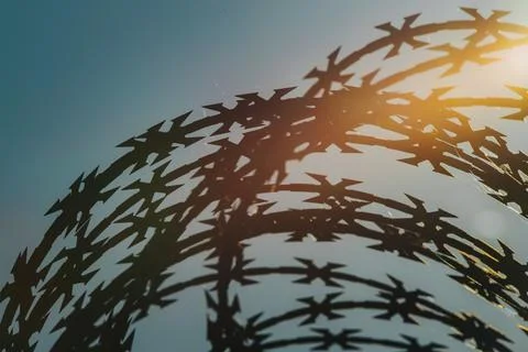 Abstract shadow pattern of intersecting star shapes against a blue sky with.. Stock Photos