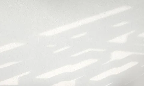 Abstract shadow of window on white concrete wall Stock Photos