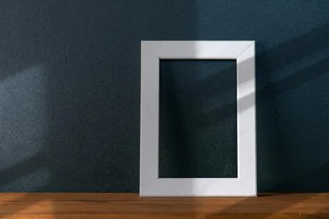 Abstract shadows of lines on black wall in the room with minimal interior Stock Photos