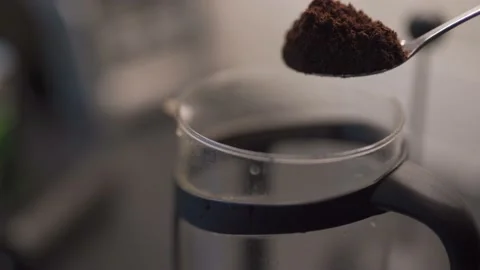 Abstract shallow focus shot of coffee grounds on a spoon into coffee maker 動画素材 164727283