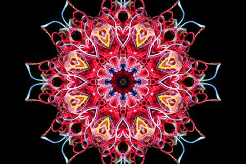 Abstract shape from multicolored threads on a black background Illustrazione stock