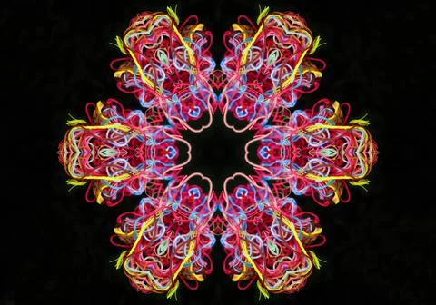 Abstract shape from multicolored threads on a black background Illustrazione stock