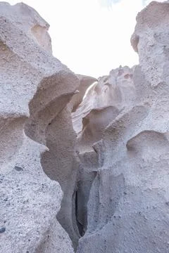 Abstract shapes created by the constant winds on the walls of the coast of Stock Photos