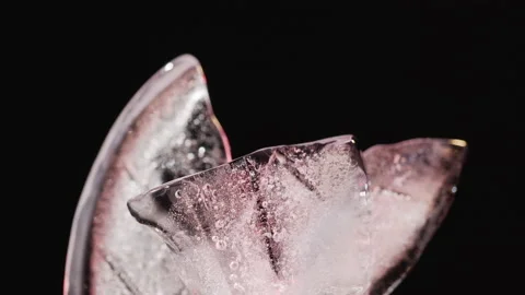 Abstract shapes from ice illuminated with multicolored light Video stock 136085046