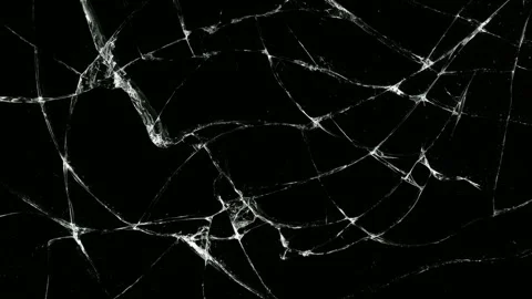 Abstract shattered glass background with bright crack lines on black, hand .. Видео 342040931