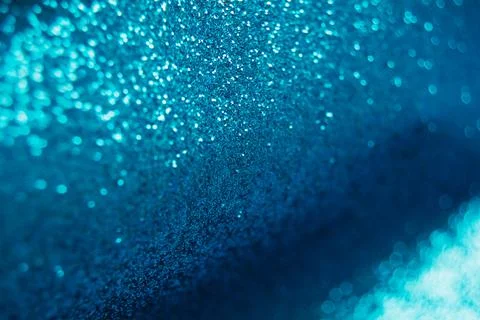 Abstract shiny blurred blue background. Textured glittering backdrop Stock Photos