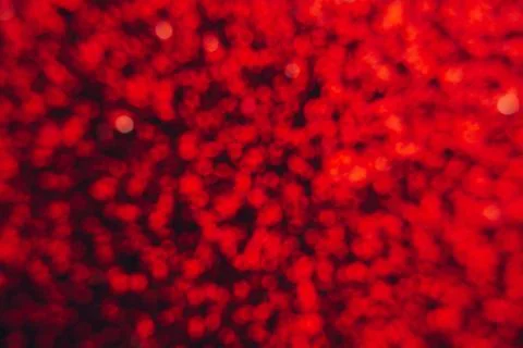 Abstract shiny blurred red background. Textured glittering backdrop Stock Photos