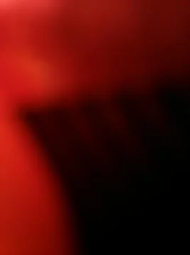 Abstract shiny red background with different elements and black parts in spac 스톡 사진