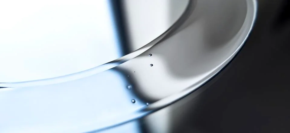 An abstract shiny silver surface with tiny drops on it Stock Photos