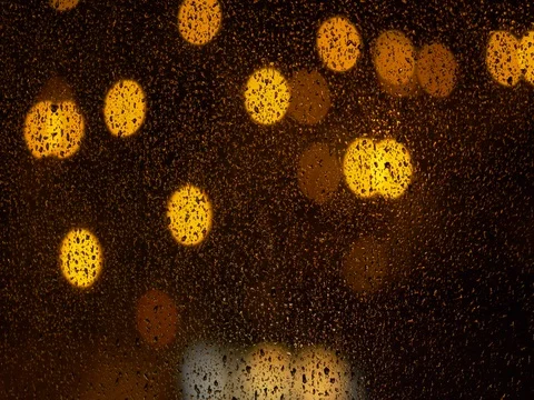 Abstract shot of city lights during storm at night - ungraded footage Video stock 80962792