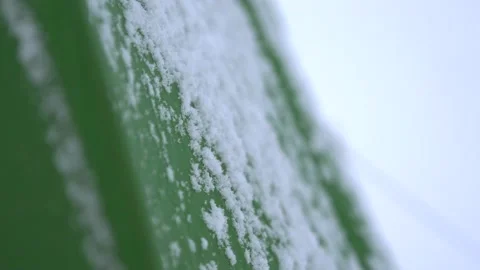 Abstract shot of snow falling on a green tent 스톡 동영상 146140002