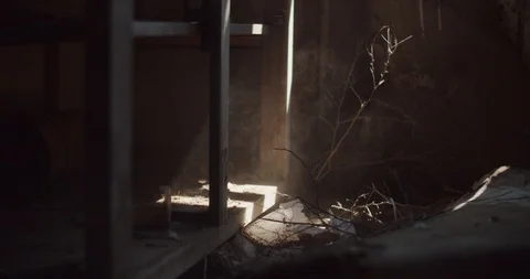 Abstract shot of sun beam through dust in abandoned ghost town house Stock Footage 111398157