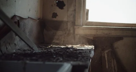 Abstract shot of sun beam through dust in abandoned ghost town house Stock Footage 111398161