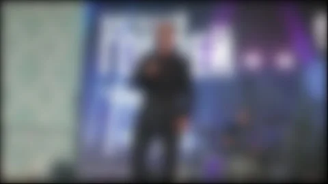 An Abstract Shot Of A Vocalist Performing In Front Of A Large Screen. A Blurred Stock Footage 325296437