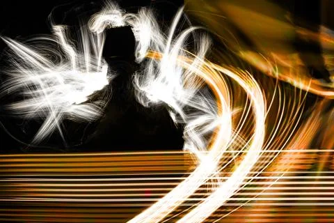 Abstract silhouette with dynamic luminous light trails and selective focus. Stock Illustration