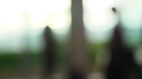 Abstract silhouettes of people on the background of the window. Colored blurred Stock Footage 137737568