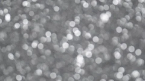Abstract silver background, motion blurred silver lights, bokeh effect. Stock Footage 252063751