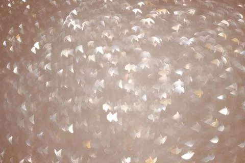 An abstract silver background with sparkle lights and bokeh. Stock Photos