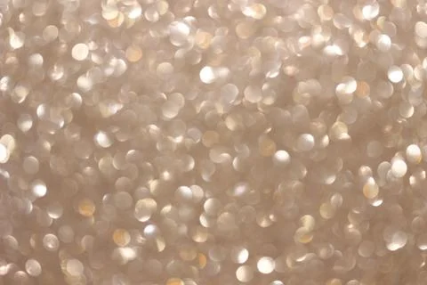An abstract silver background with sparkle lights and bokeh. Stock Photos