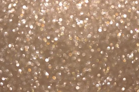 An abstract silver background with sparkle lights and bokeh. Stock Photos