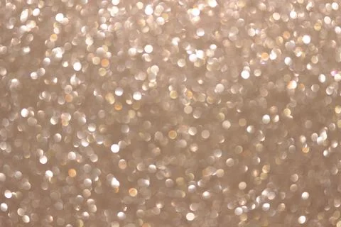 An abstract silver background with sparkle lights and bokeh. Stock Photos