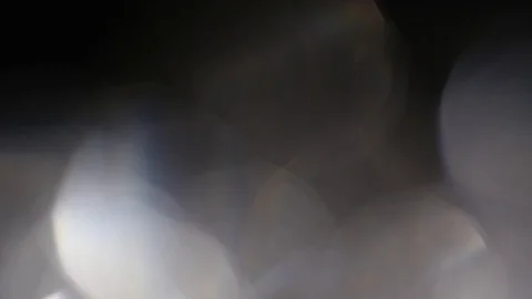 Abstract Silver colored bokeh, defocus round, circle on black background Video stock 125788420