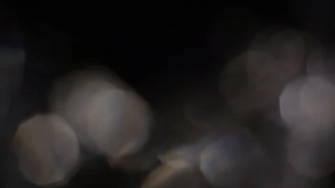 Abstract Silver colored bokeh, defocus round, circle on black background Stock Footage 125788422