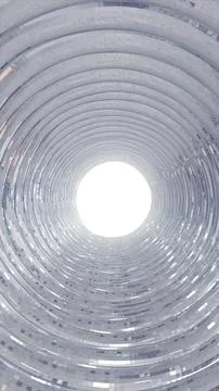 Abstract silver concentric tunnel with reflective geometric rings and a bri.. Stock Photos