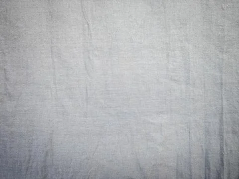 Abstract silver gray fabric texture background with wavy moire pattern Фото