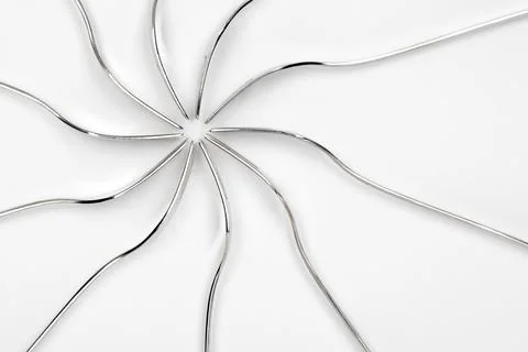 Abstract silver lines form a symmetrical pattern on a white background, Fork Foto stock