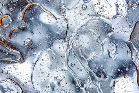 Abstract silver metallic liquid fluid background Stock Photos