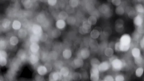 Abstract silver monochrome bokeh background with soft shimmering Stock Footage 346717373