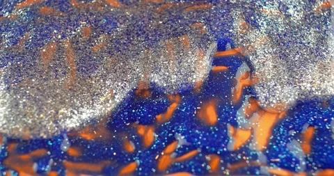 Abstract silver, orange and blue true glitter texture background Stock Footage 253310510