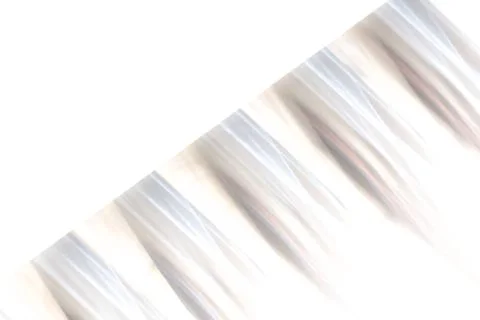 Abstract silver pattern background - textured blurry stripes with isolated wh Stock Photos