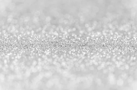 Abstract silver texture glitter lights background. de-focused. Stock Photos