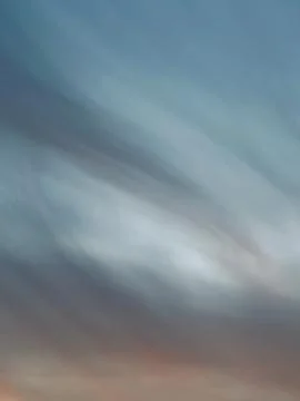 Abstract sky background with dramatic cloud textures and soft colorful gradient Stock Photos