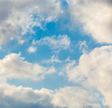 Abstract sky background with fluffy clouds, cloudscape pattern, copy space Fotos Stock