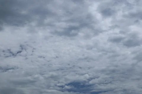 Abstract Sky View with Dramatic Cloudscape and Diminishing Blue Patches Stock Photos