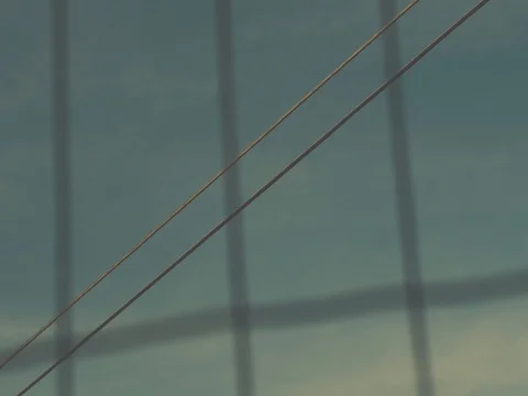 Abstract Slider Motion Power Line Through Fence Stock Footage 73530946