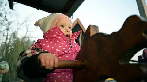 Abstract Small Child Riding on a Swing in the Park Stock Footage