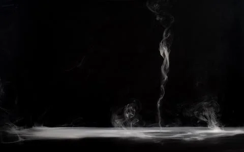 Abstract smoke on a dark background . Stock Photos