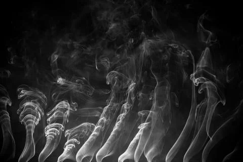 Abstract smoke on a dark background . Stock Photos