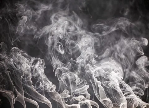 Abstract smoke on a dark background . Stock Photos