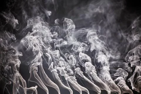 Abstract smoke on a dark background . Stock Photos