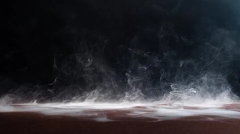 Abstract smoke on a dark background . Stock Photos