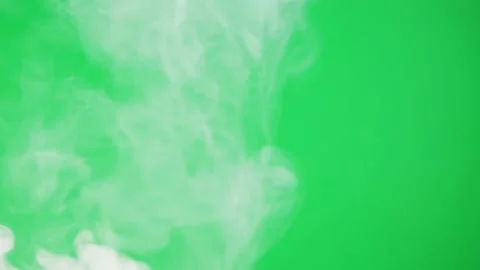 Abstract smoke on green chroma key background. Smoking, steam clouds close-up. Stock Footage 182000476