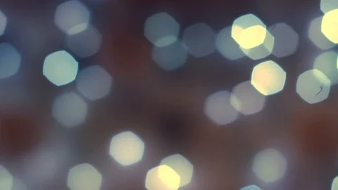 Abstract smooth bright blue and yellow bokeh lights on defocused dark background Vidéo 99884510
