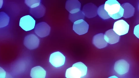 Abstract smooth bright blue bokeh lights on defocused dark purple background Stock Footage 99884614