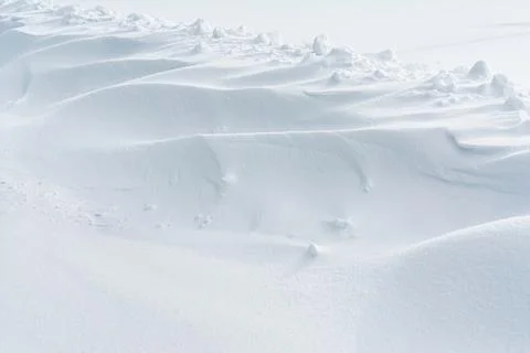 Abstract snow texture background. Close up snow dunes lines. Snowdrift natu.. Stock Photos
