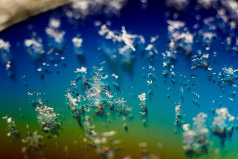 Abstract snowflake on the colored background Close-up. Macro photograph snowf Stock Photos